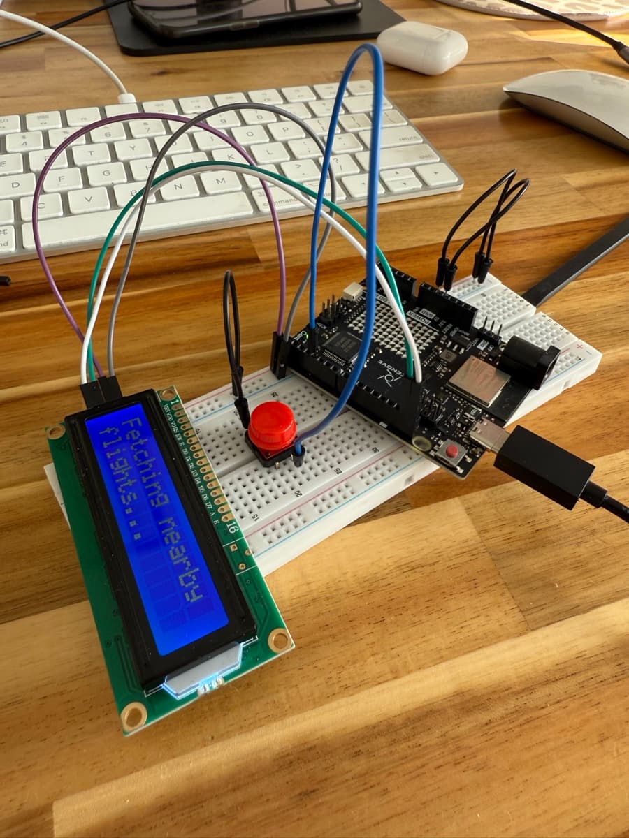 Flight Tracker hardware — Arduino Uno R4 WiFi wired to an LCD display and button on a breadboard